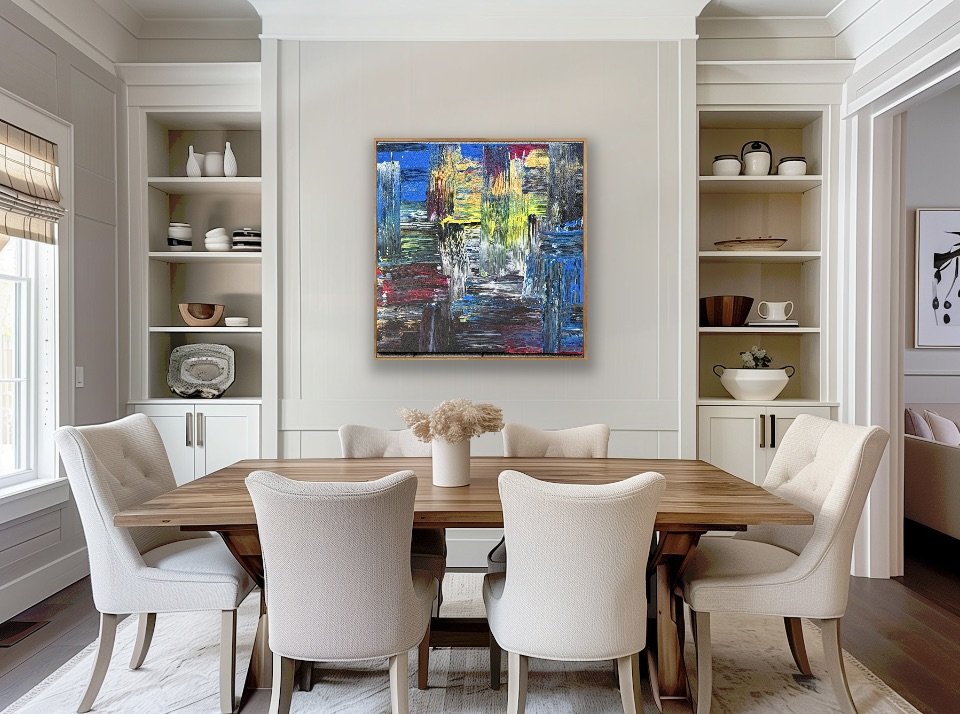 A dining room with a wooden table, six upholstered chairs, a vase with dried flowers, built-in shelves with decorative dishes, and an abstract colorful painting on the wall.