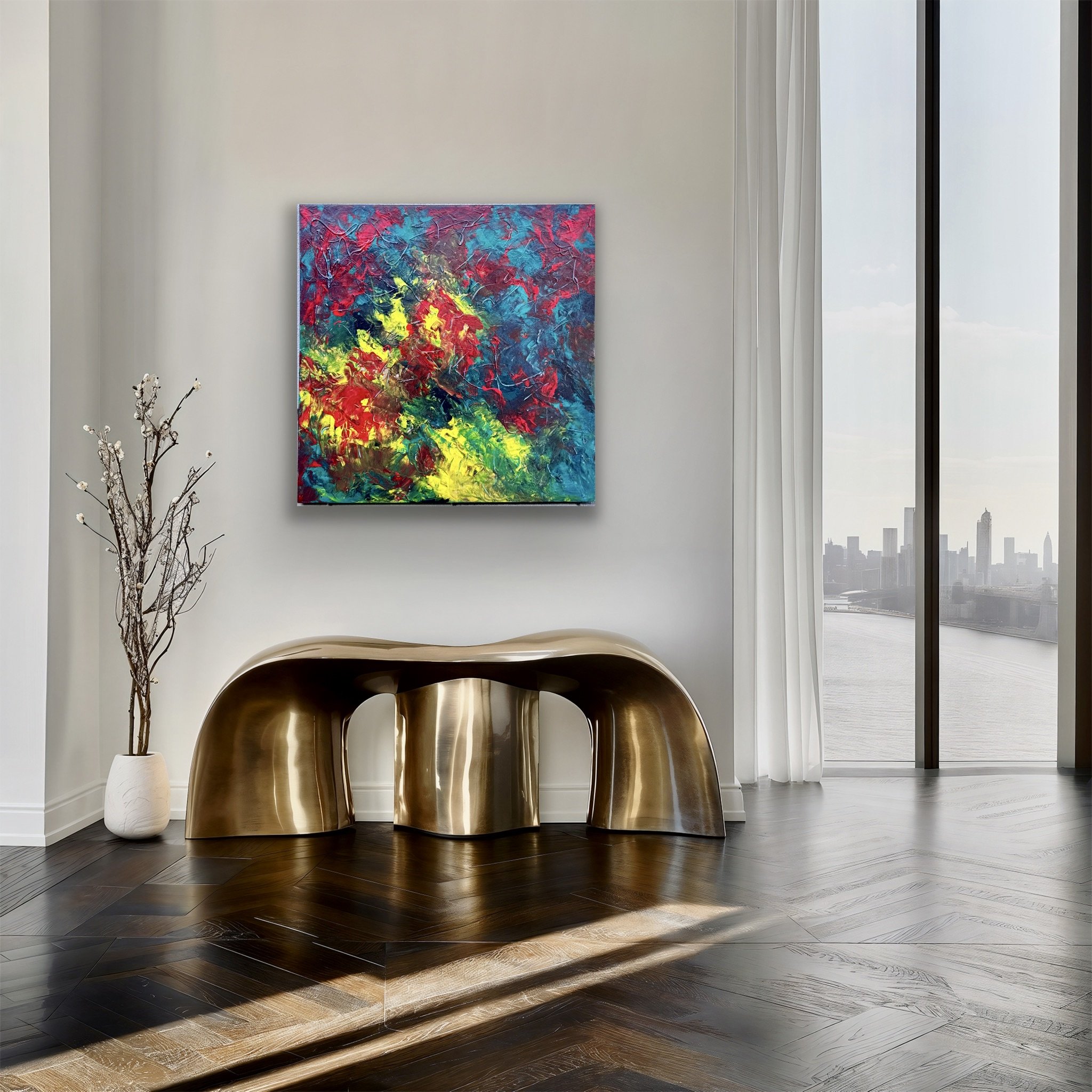 Modern interior with a vibrant abstract painting on a white wall, a decorative metallic table, a vase with minimalist branches, and large windows showing a city skyline with tall buildings and a river.