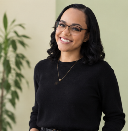 Candace Williams, founder of VEYA ADHD and Executive function Coaching, smiling in front of a green wall