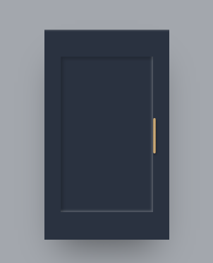 A closed navy blue cabinet door with a gold handle against a gray wall.