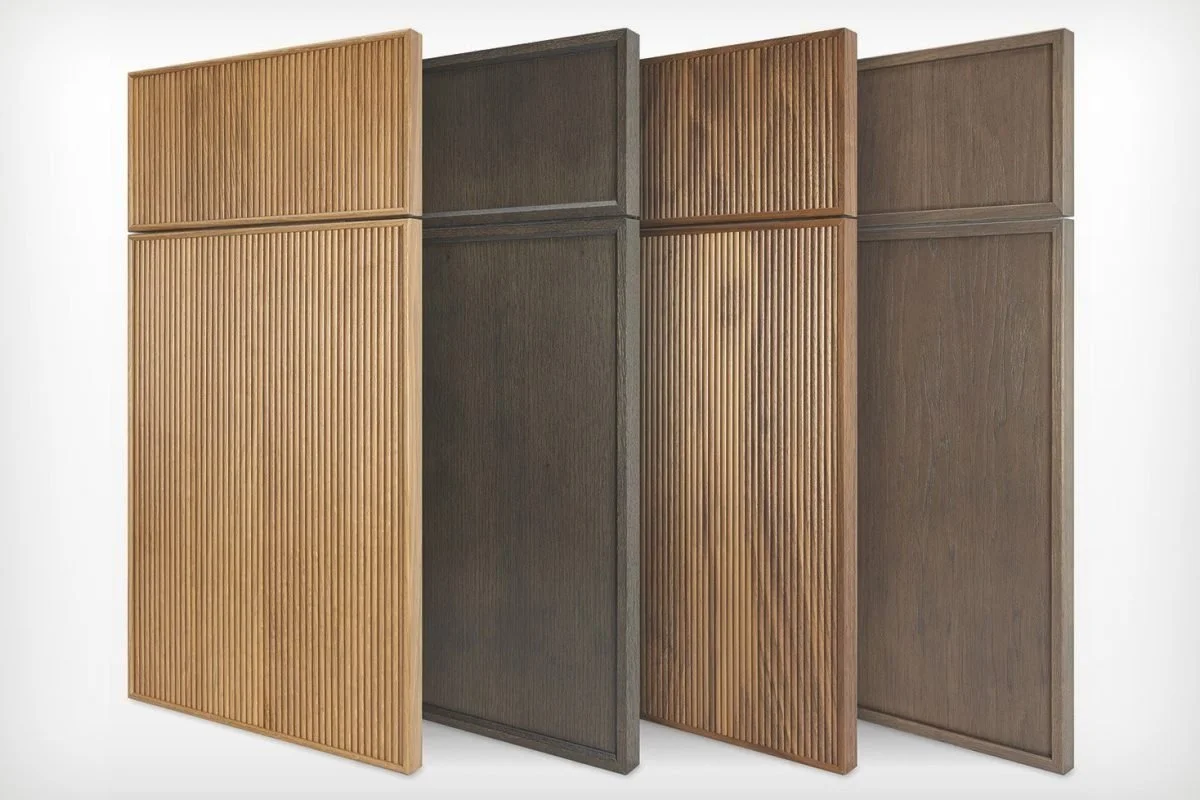 Four wooden acoustic panels with different shades, arranged side by side, with some featuring vertical slats and others flat surfaces.