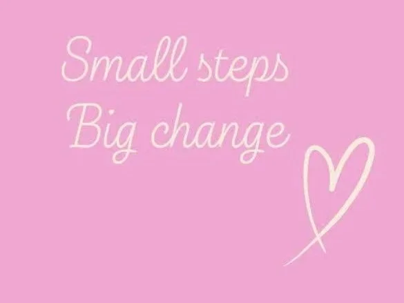 Pink background with white cursive text that reads, "Small steps Big change" and a simple line drawing of a heart.