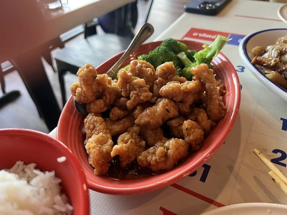 Plate of Chinese-style crispy fried chicken with broccoli.