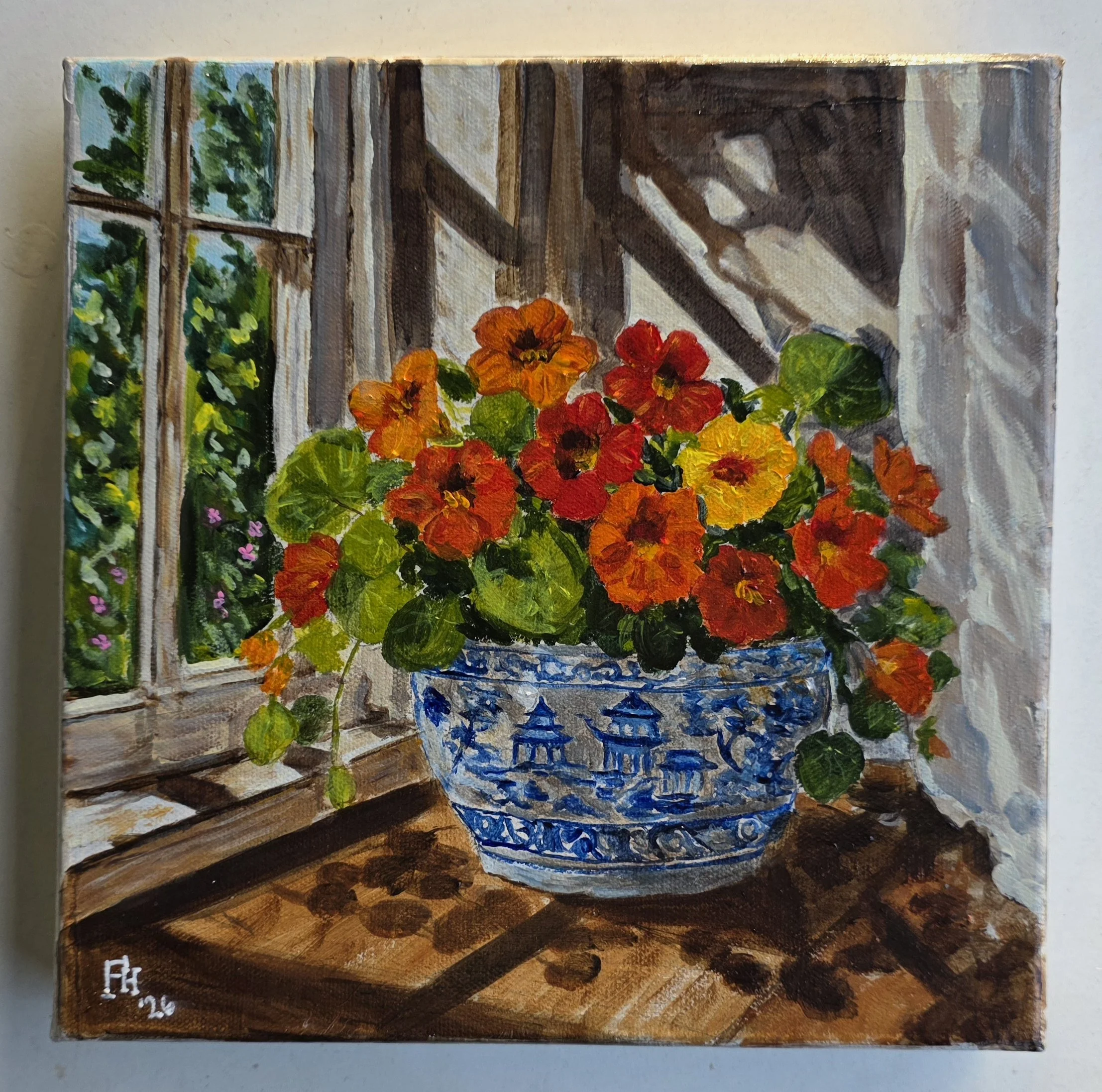 A small painted canvas depicting a wooden porch or balcony with colorful flowers in the foreground and green plants outside the window.