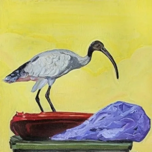 A painting of a bird with a long beak standing on a red object with a purple shape nearby against a yellow background.