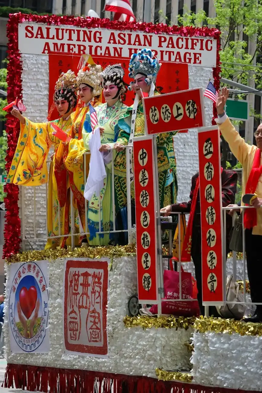 Asian Pacific American Heritage parade float with performers in traditional Chinese opera costumes