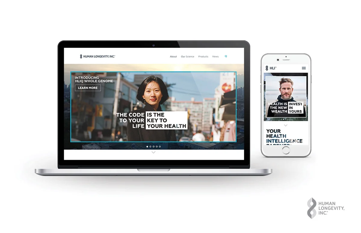 A laptop and a smartphone displaying a health-related website for Human Longevity, Inc., featuring images of diverse individuals and text about health and genome research.