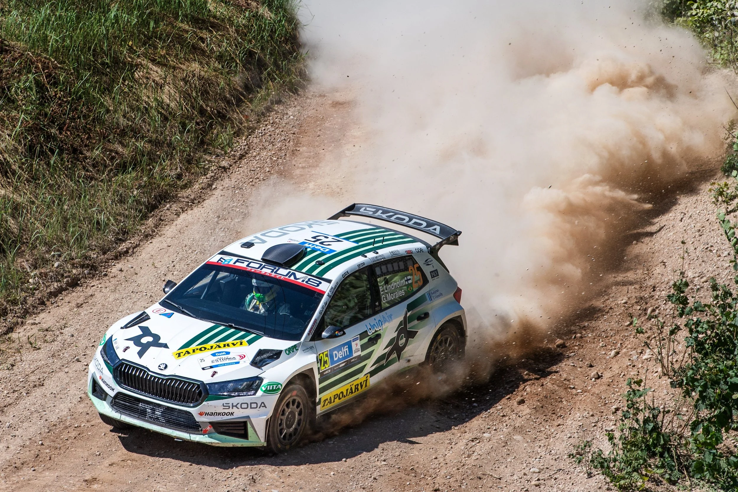 Rally car racing on gravel