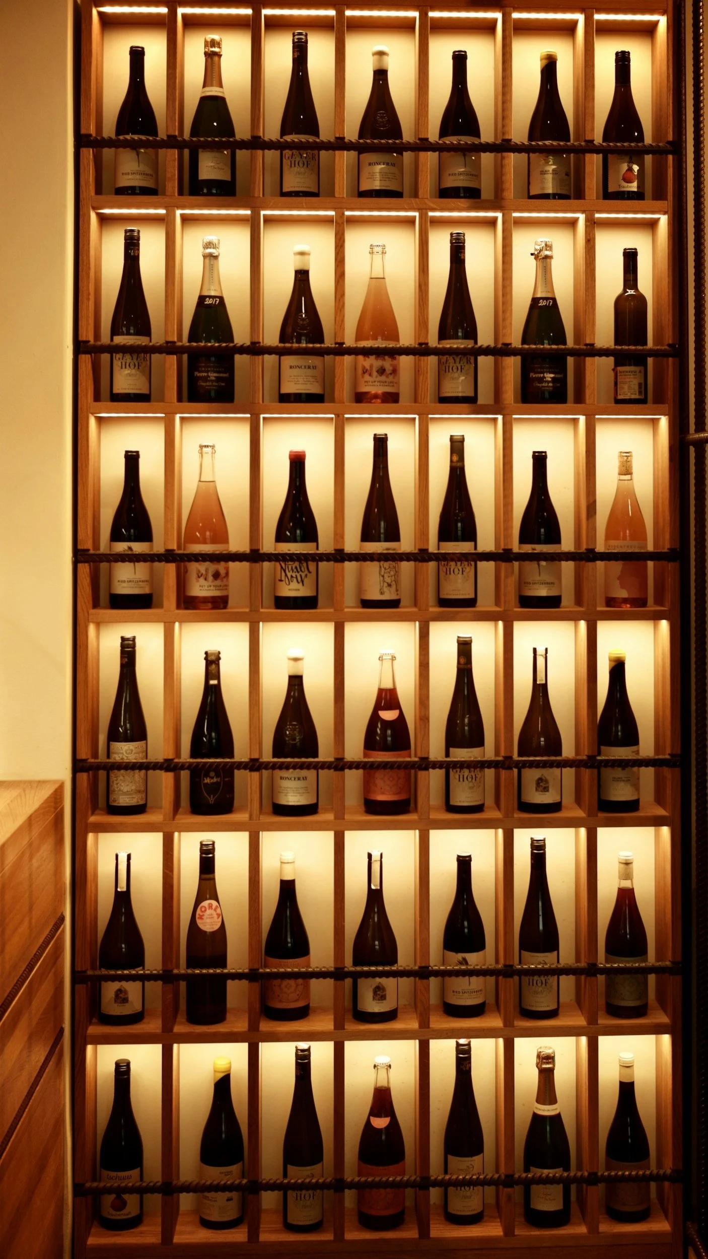 Fine wine bottles displayed in a cellar rack