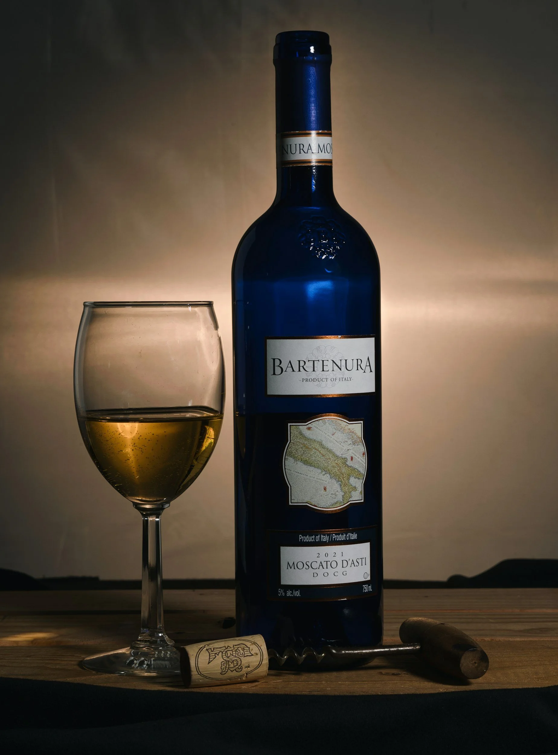 Bottle of wine and glass ready for a client enquiry