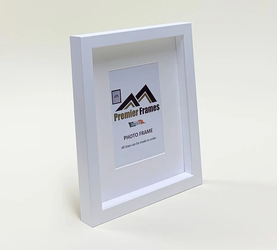 BF32WM Single Shadow Box Frame White Wood Grain 30mm Deep x 20mm on face with 20mm White spacer.