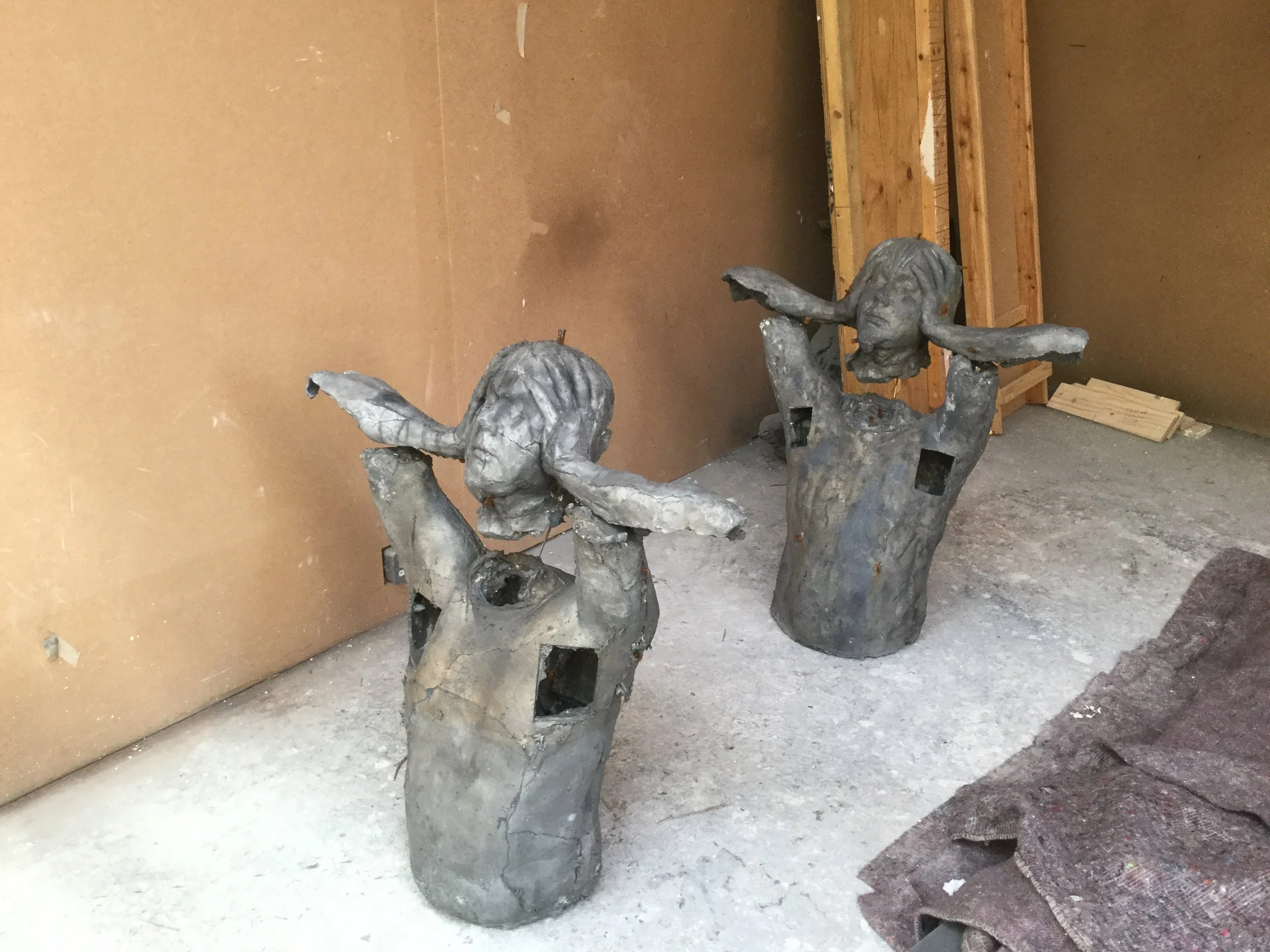 Two seated lead figures from Marc Quinn’s Emotional Detox series.