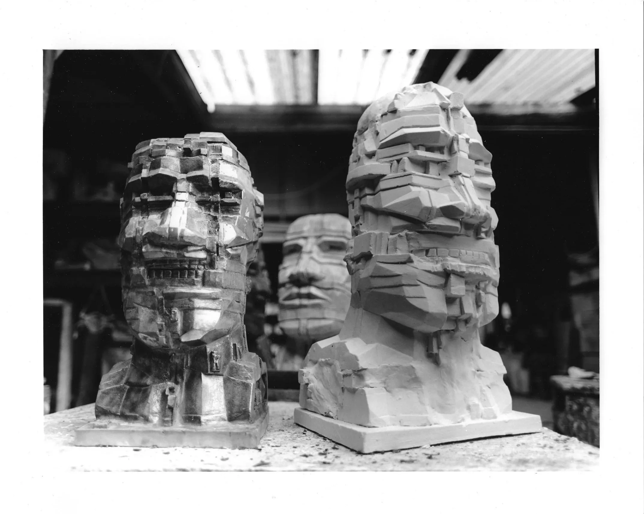 Bronze and plaster versions of Eduardo Paolozzi’s Head, 1993, photographed together at Arch Bronze.