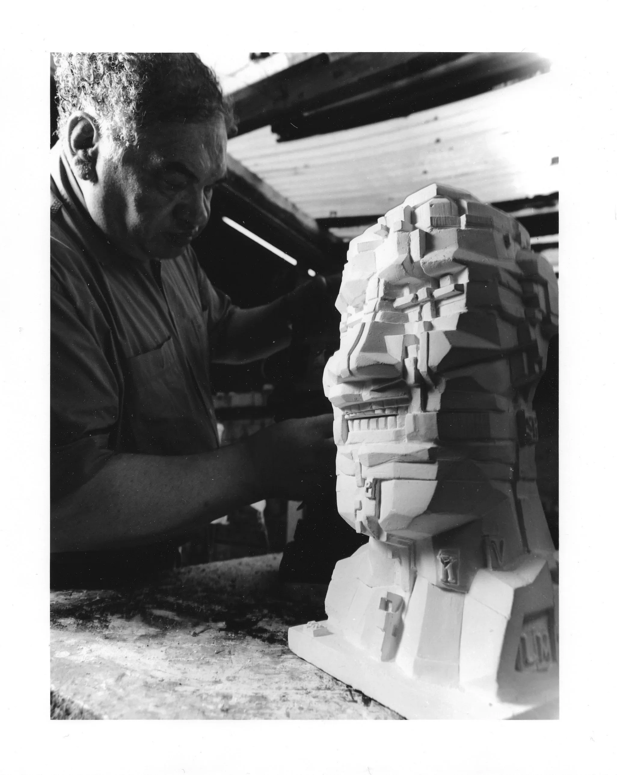 Sir Eduardo Paolozzi working on the plaster sculpture of Head, 1993, at Arch Bronze.