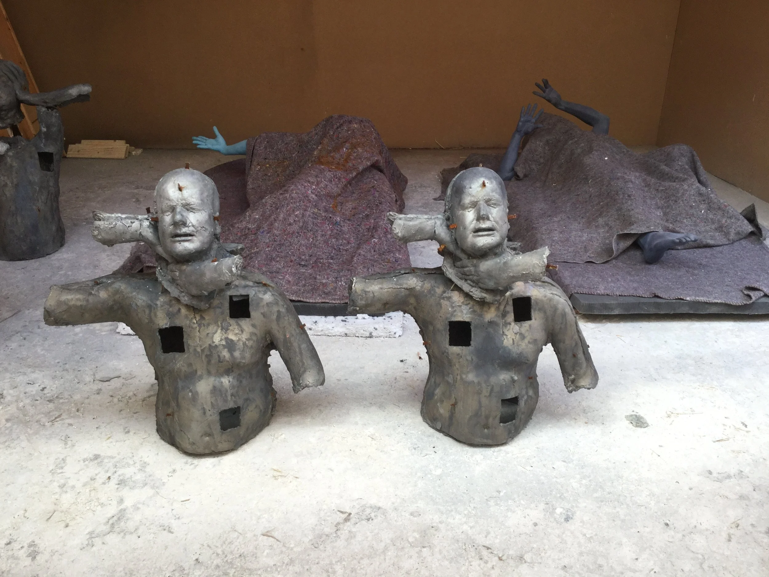 Pair of lead casts from Emotional Detox during production at Arch Bronze.