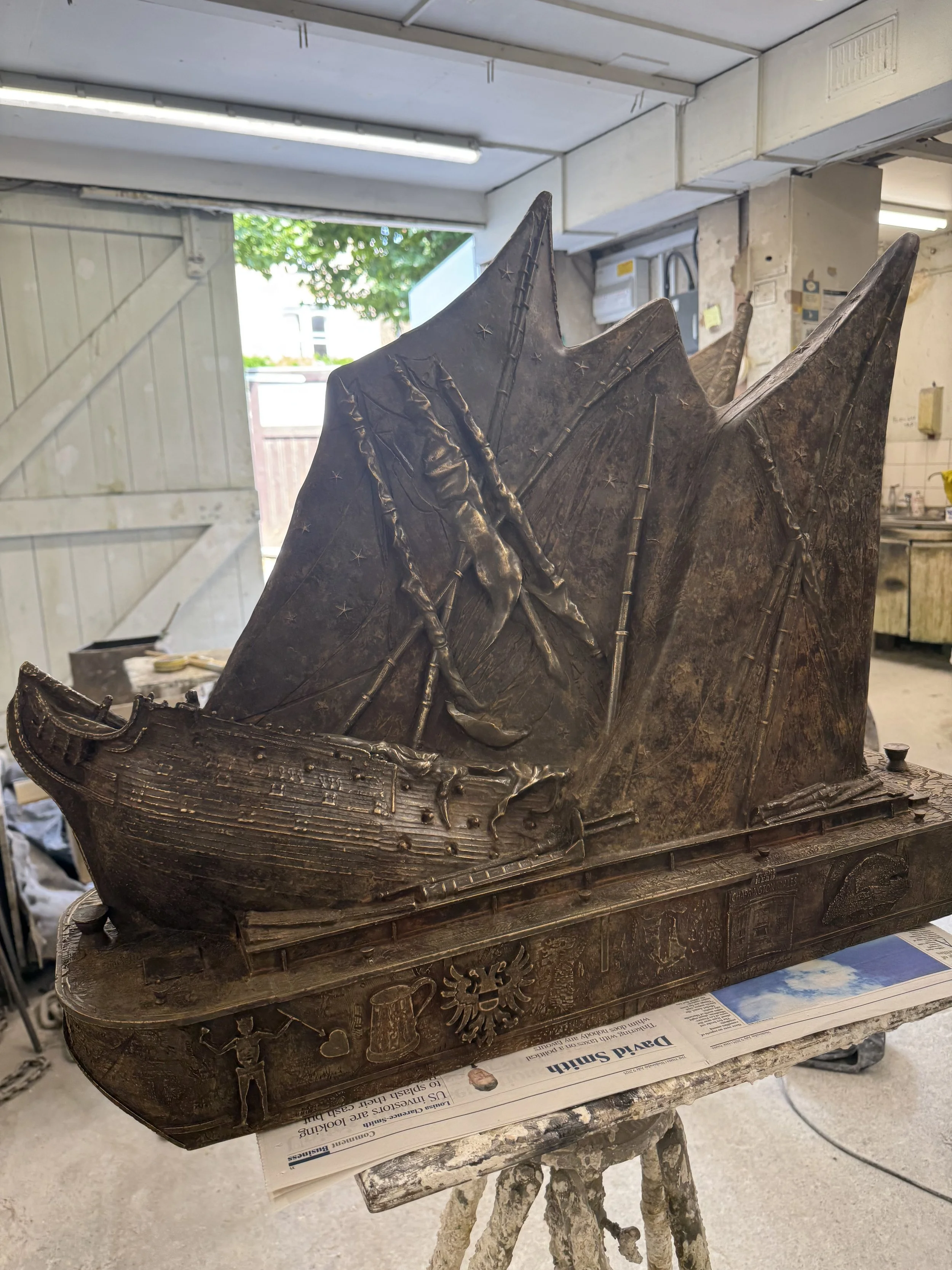 Hew Locke bronze boat sculpture from Cargoes at Arch Bronze, with multiple sails and sculpted maritime details.