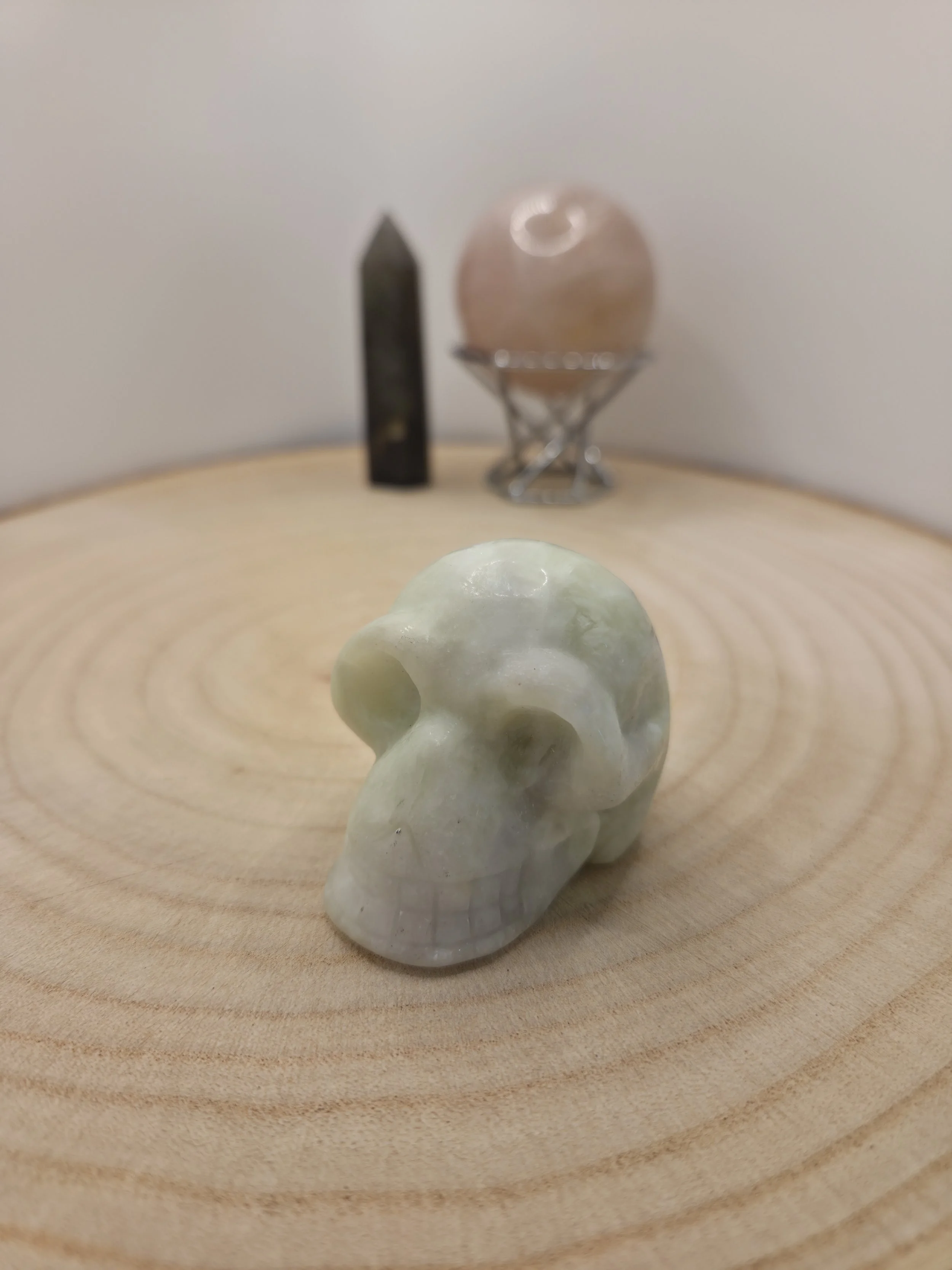Green jade skull carving