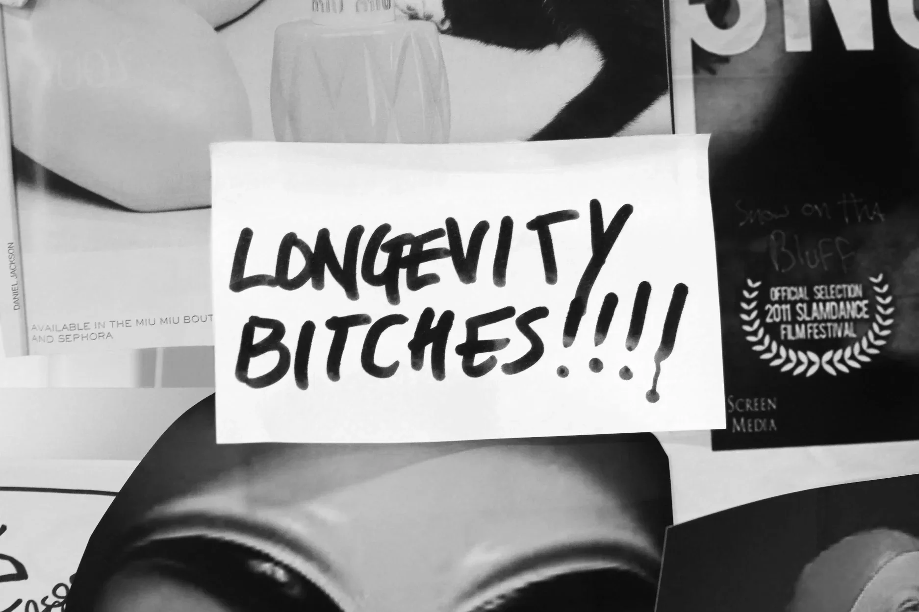 Black & white photo of a post it note created during a brainstorm by participants on The GirlHood creative traineeship. It reads: Longevity Bitches!!!!