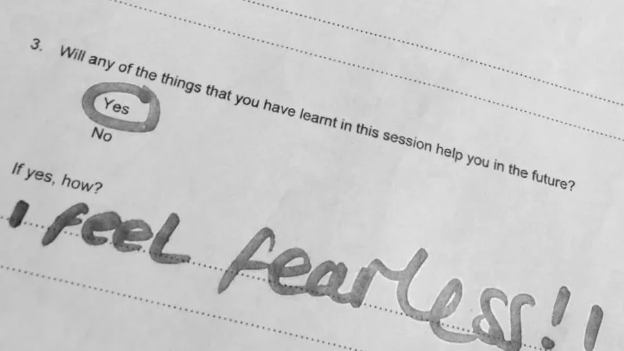 Black & white photo of an evaluation form from a participant of The GirlHood launch at WOW Women of the World Festival 2015. It reads I feel fearless!!