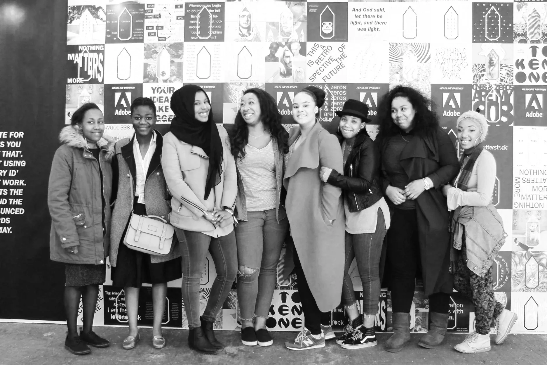 Photo of the 8 GirlHood Creative Traineeship participants smiling at the D&AD New Blood Festival
