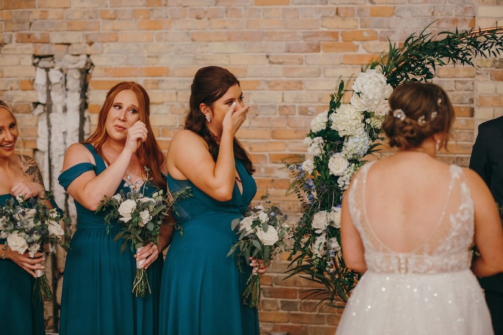 emotional bridesmaids moment during ceremony