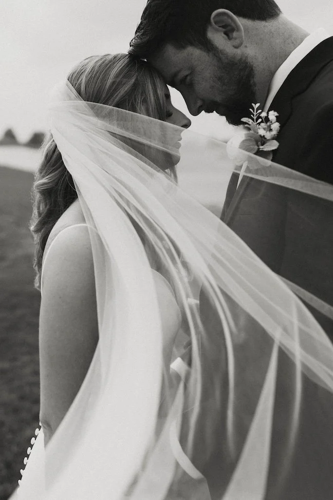 Bride and Groom intimate black and white veil