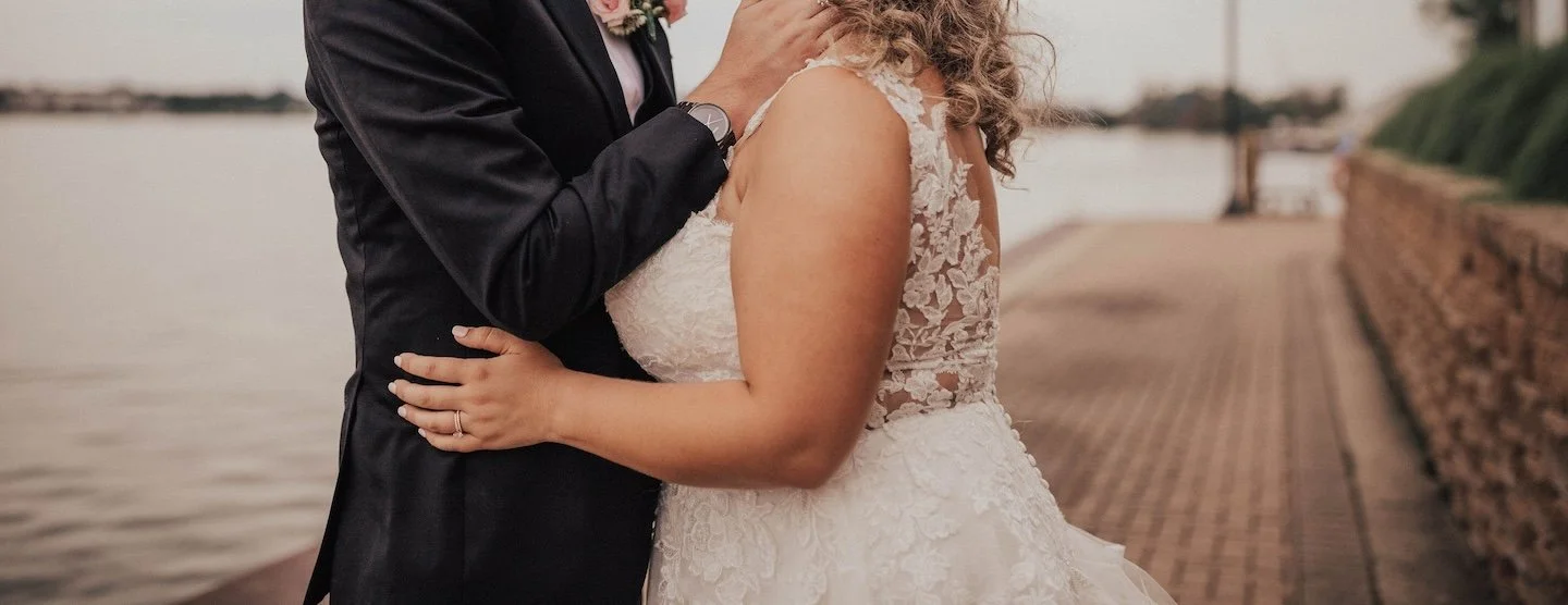bride and groom intimate moment on the lakeshore