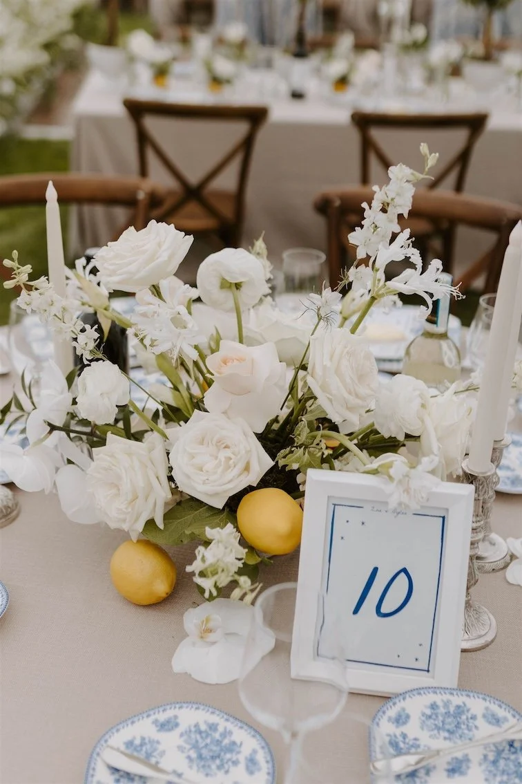 Beautiful White Rose and Orchid Wedding Centerpiece accented with Blue and White China