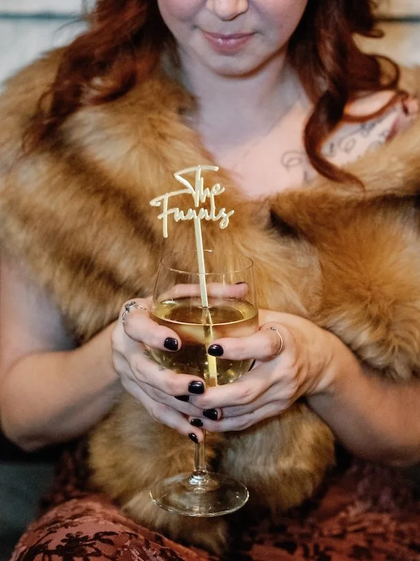 Bridesmaids Holding Cocktail with Custom Swizzle Stick