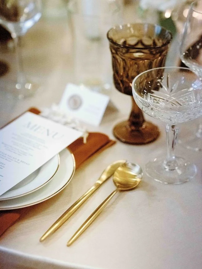 beautiful neutral palette with menu and placecards, lots of glassware