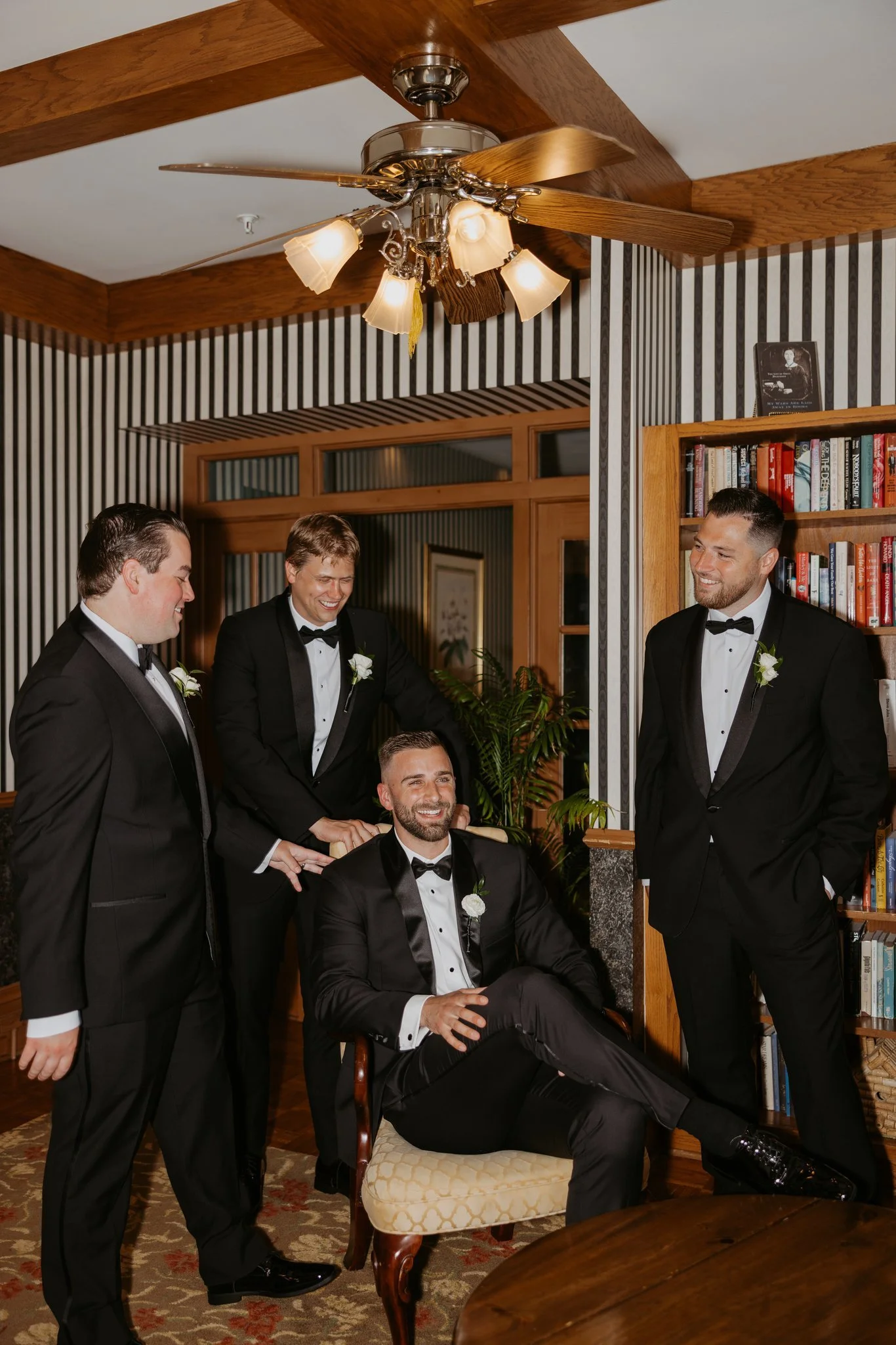 Atticus and his groomsmen in black tuxedos at the Perry Hotel in Petoskey. Photography by Amelie Ferdais.