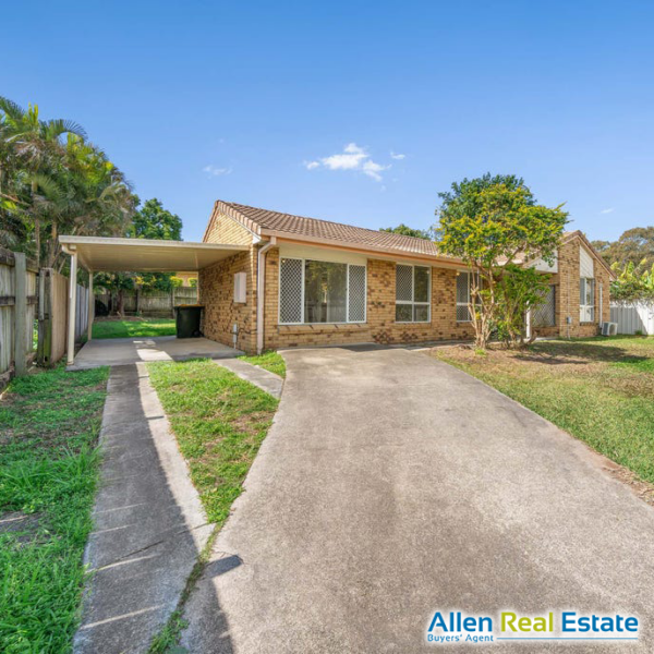 Established single-storey brick home with a tiled roof, carport and front lawn.
