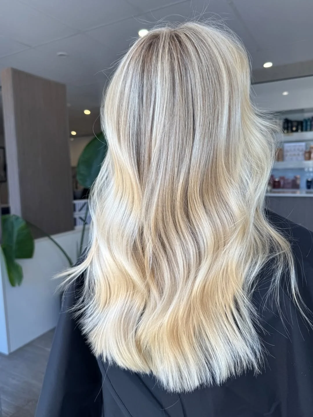 Soft, lived-in blonde highlights and waves by Chelsea at Alkemi Salon in Mount Pleasant.