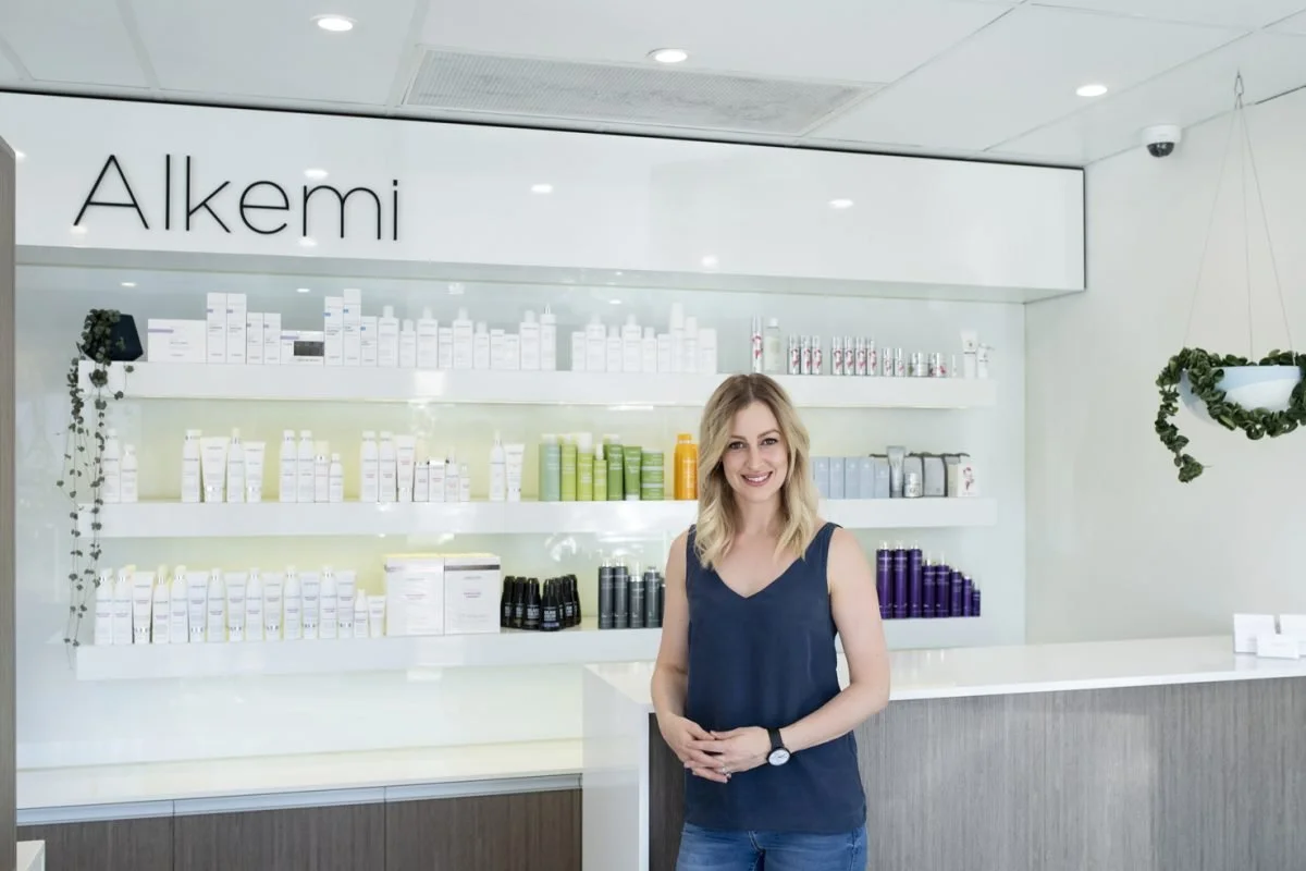 Anita at the front desk of Alkemi hair salon in Mount Pleasant, Perth