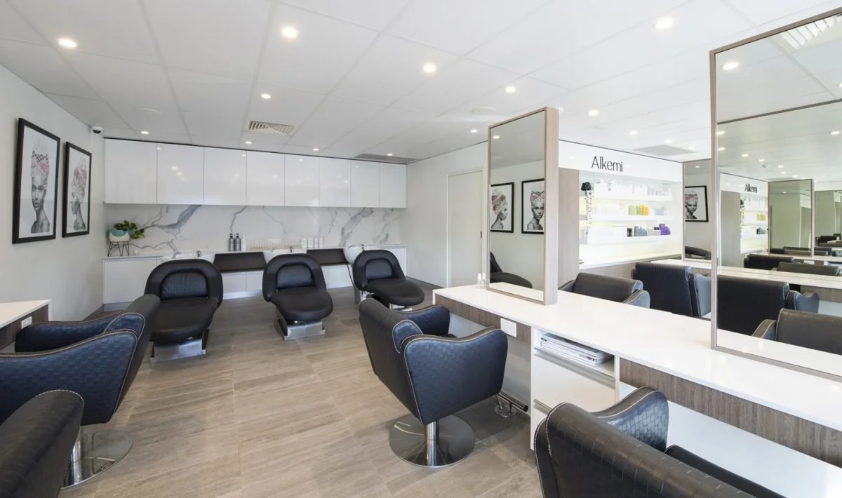 Styling stations inside Alkemi hair salon in Mount Pleasant
