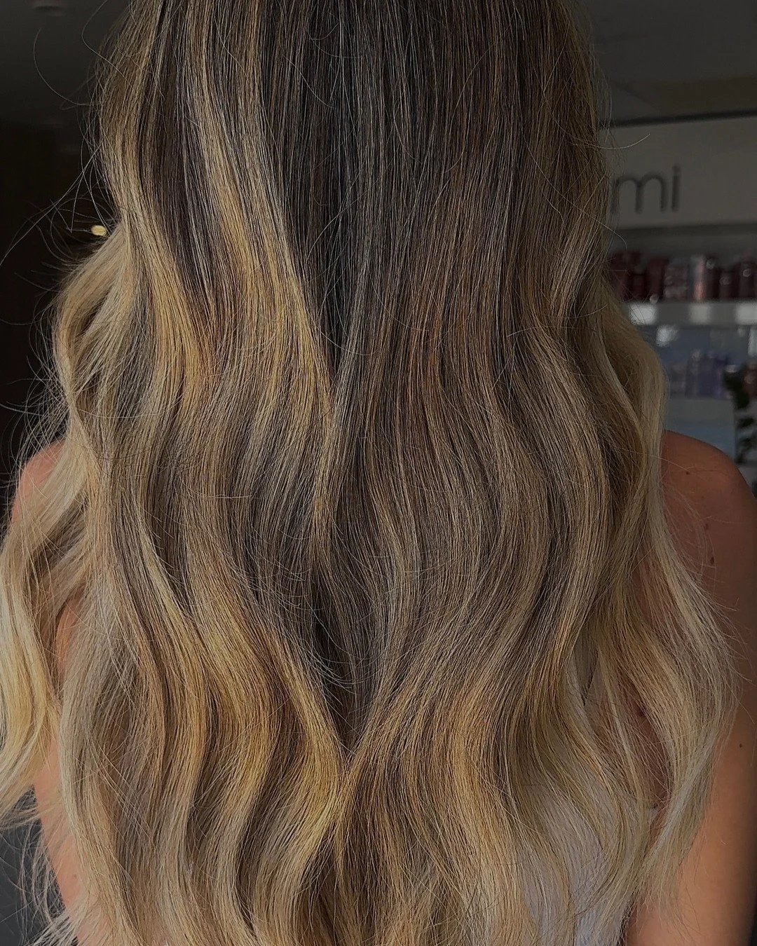 Golden dimensional lived-in blonde colour with soft waves, created at Alkemi Salon in Mount Pleasant.