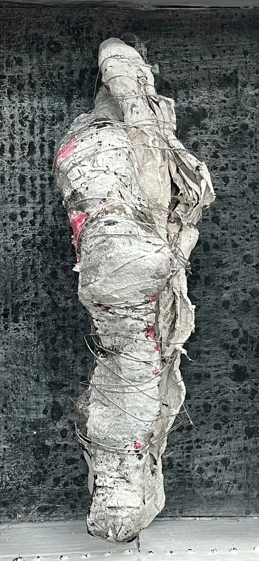 Couple Wrapped with Wire - 8.5" x 14" x 4". Cardboard box, newspaper, Plaster of Paris, ink and acrylic paint and wire