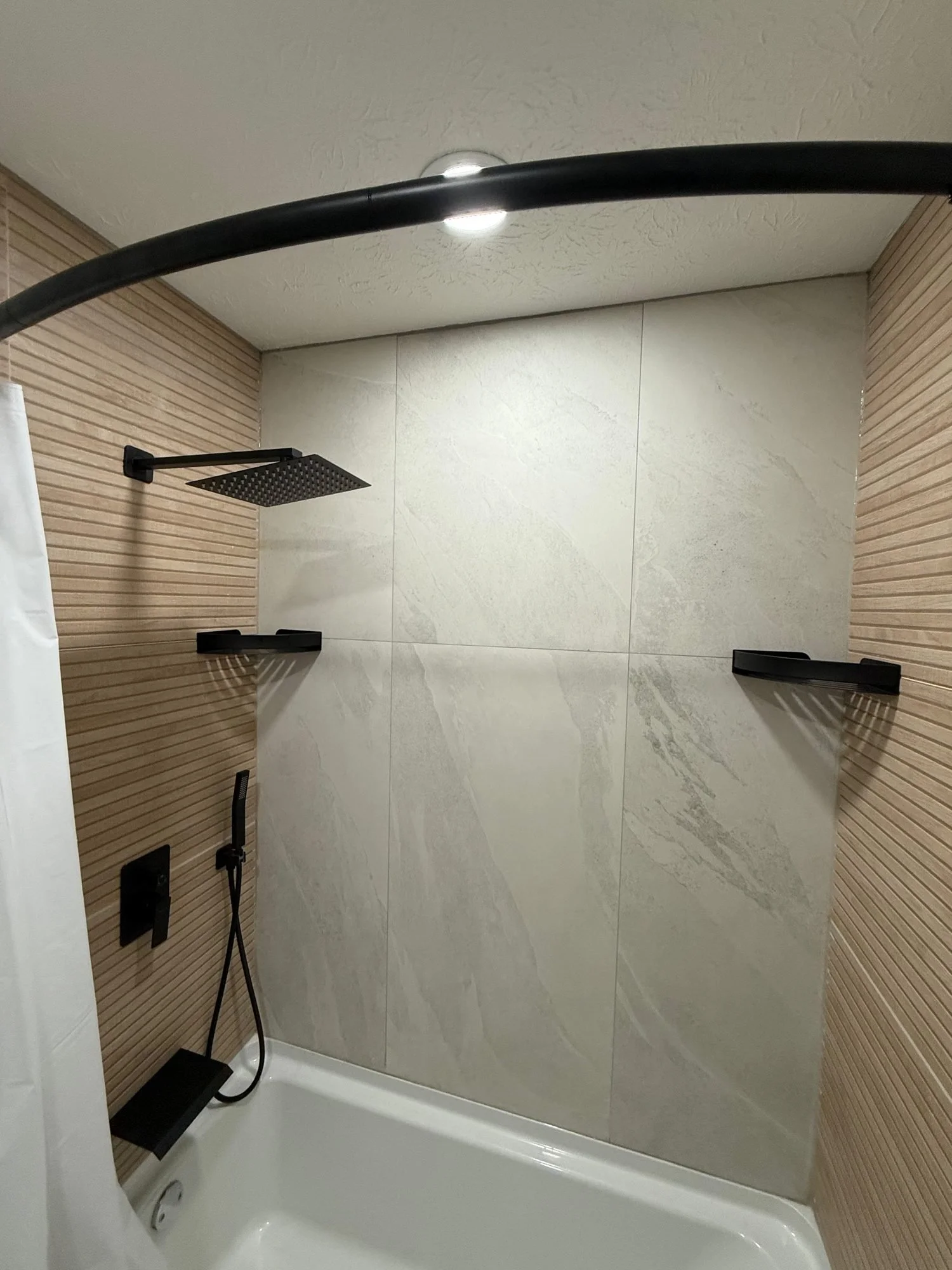 tub-shower-tile-black-fixtures.jpg