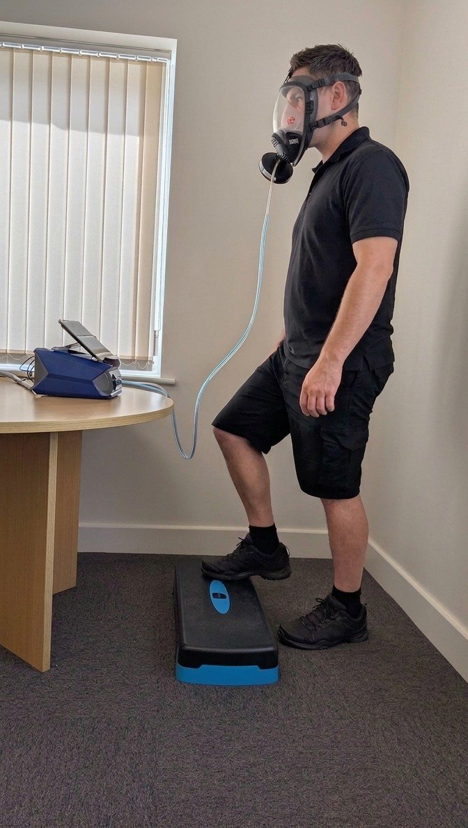 Employee undertaking quantitative face fit test