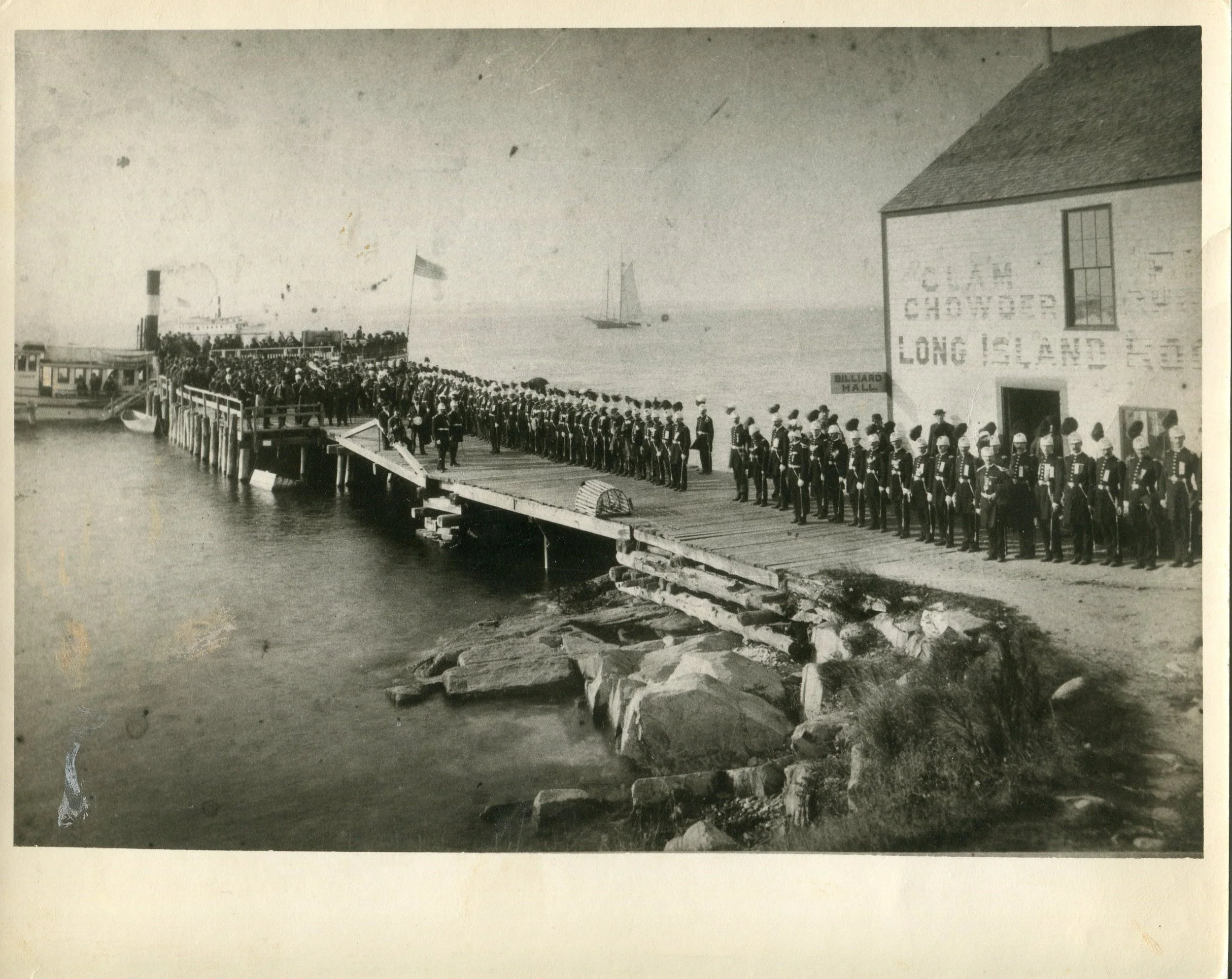 Ponce's Landing with members of the Knights Templar standing at attention in front of Hughey’s Rock Mineral Spring Cafe, ca. 1890. The steamboat Cadet is at the wharf, with another steamboat in the background. Gift of Virginia Stevens. 2002.32.6