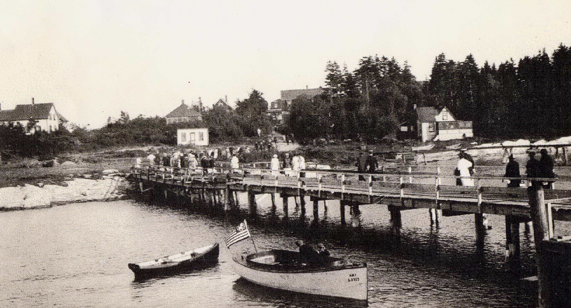 Doughty’s Landing, showing passengers heading toward land and shoreline structures, before World War II. 1930–1943. Gift of Barbara Blaisdell. 1996.53.3