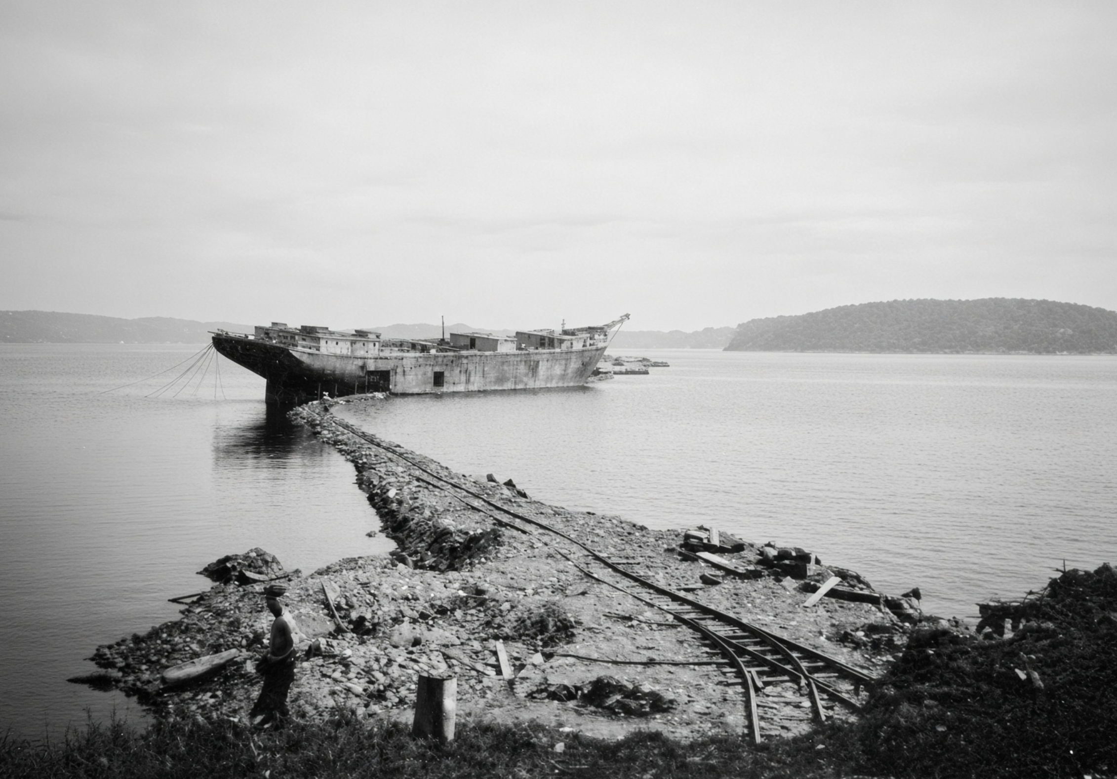 Maude M. Morey at anchor off the east end of Long Island during World War II, with tracks used to load ballast after it drifted as a fixed obstruction. 1941–1943. Gift of Joel Eastman (from National Archives). 1996.60.3