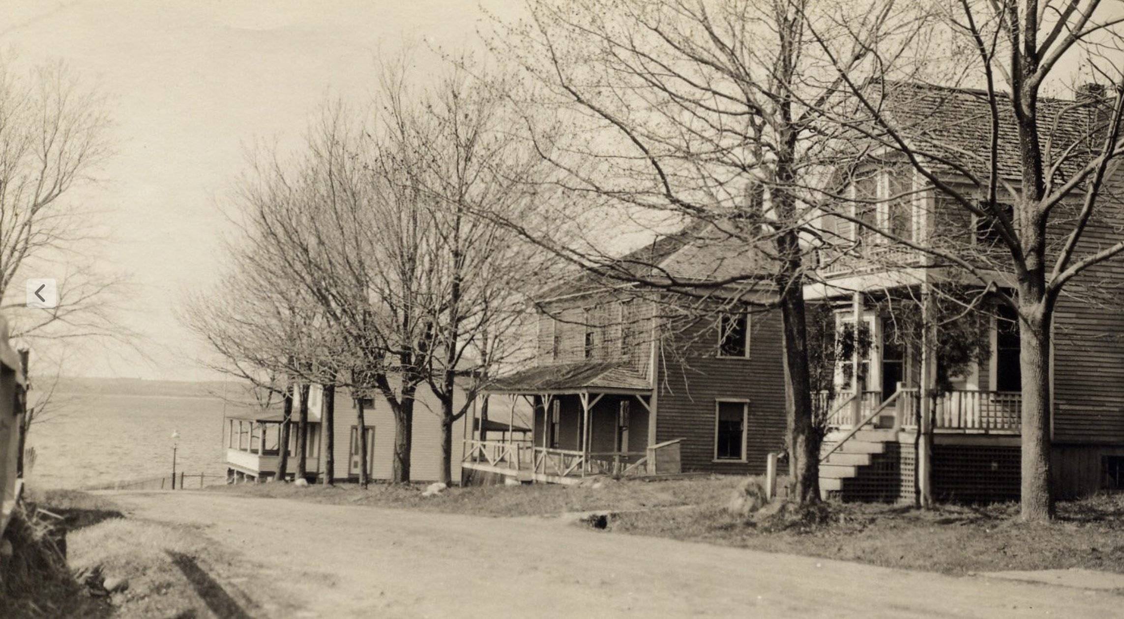 Houses on Garfield Street prior to World War II. Left to right: Long Island Community Club, Joseph and Edith Woodbury house, Clint and Gladys Johnson house. 1920–1942. Gift of Phyllis Greene. 1996.14.36