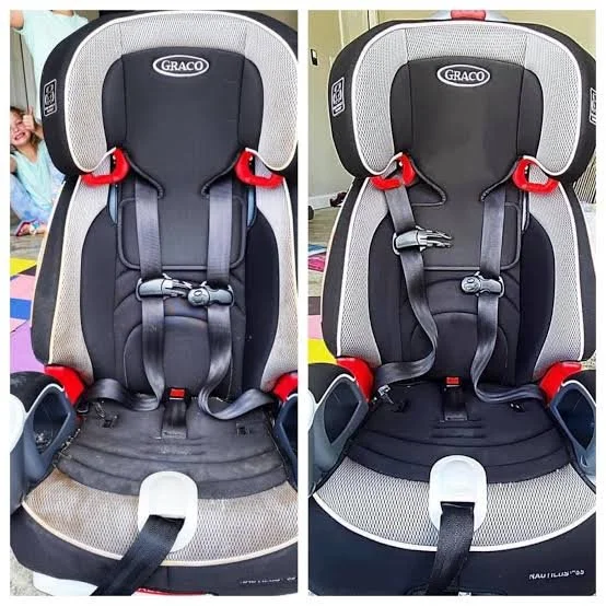 Comparison of two child car seats, both gray and black with red accents, showing different shoulder strap positions and buckle arrangements.