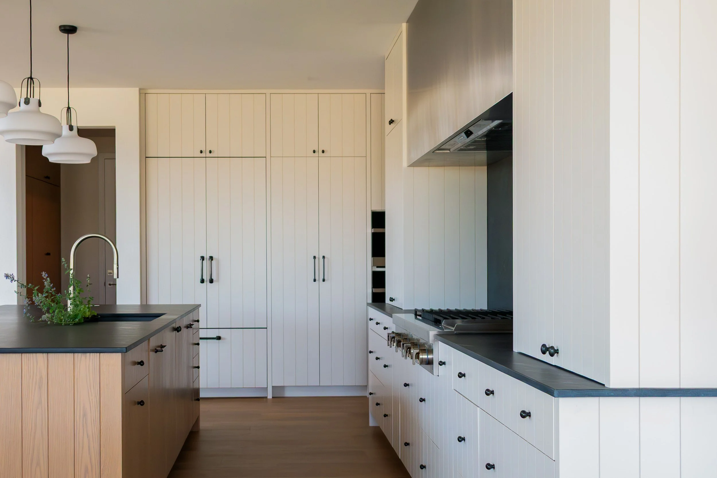 Island end and tall paneled cabinets