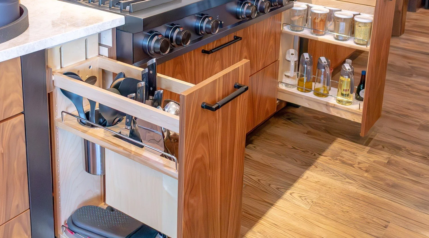 Utensil and spice pull-outs beside the range