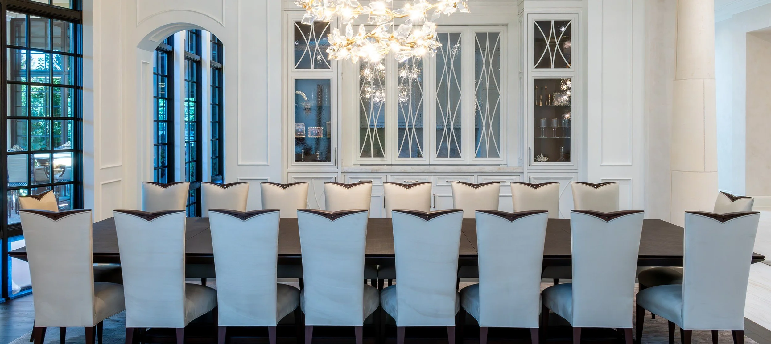 The Dining Room & Pantries: formal dining room with paneled walls and built-in china cabinets