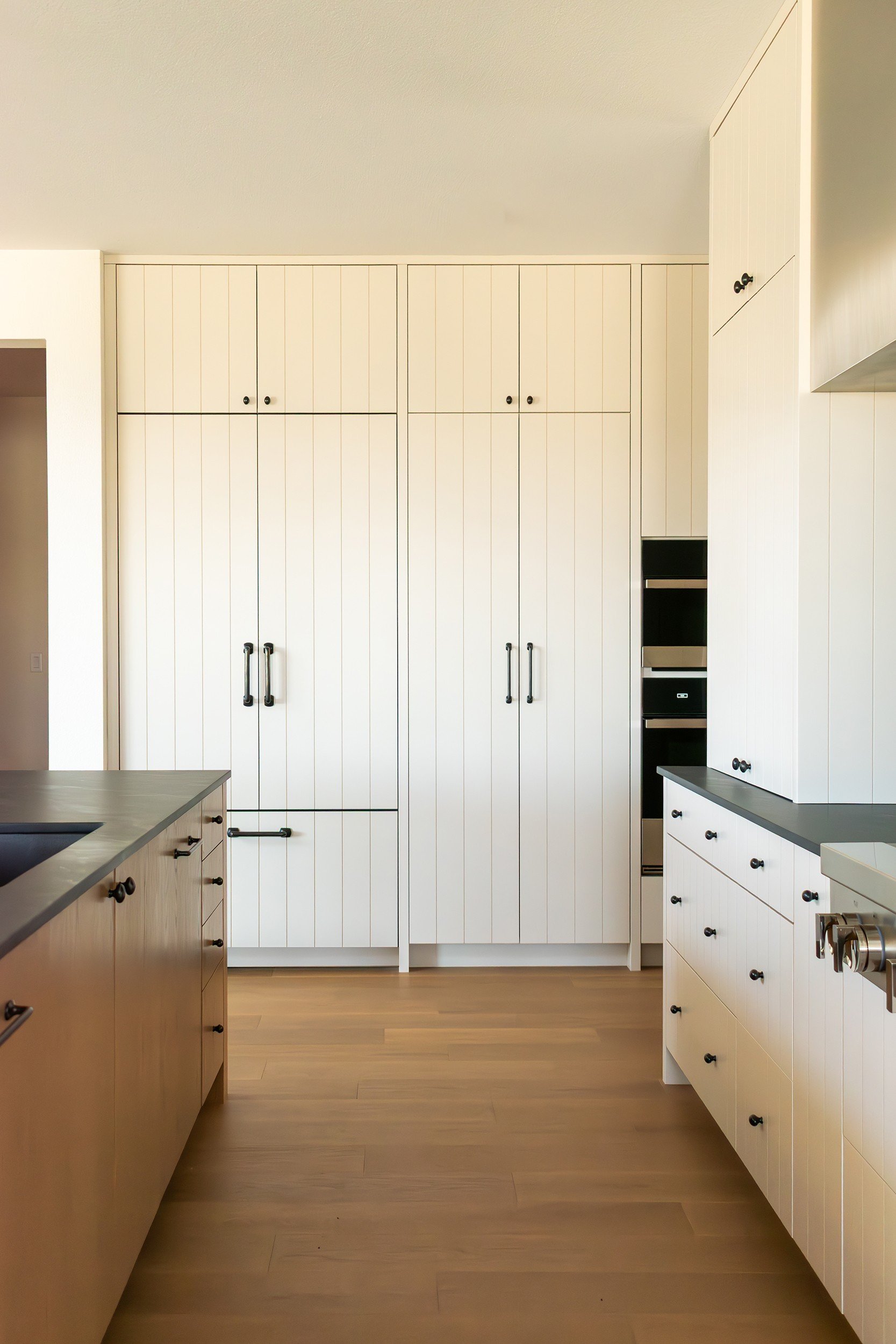 Tall paneled pantry wall
