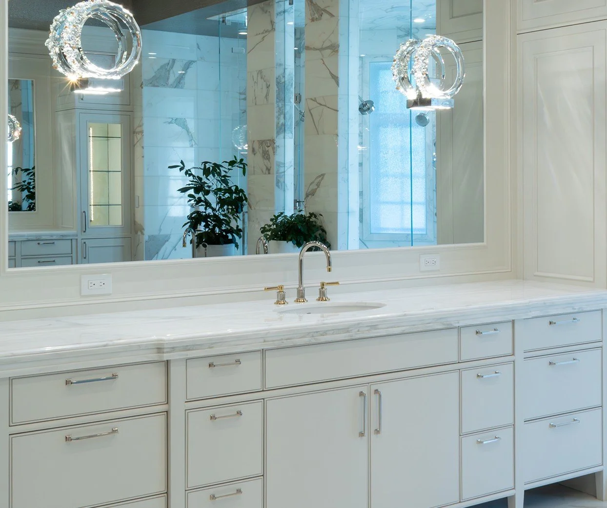 Brass faucet on a marble vanity top