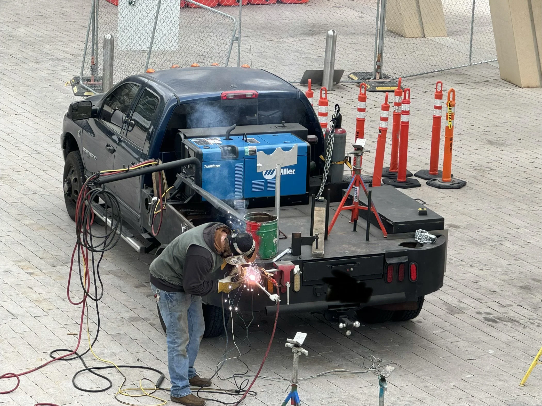 Mobile welding truck with Miller welder set up for an on-site repair at a commercial job site